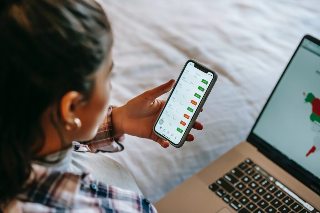 woman looking at how to create sales funnels on her mobile phone