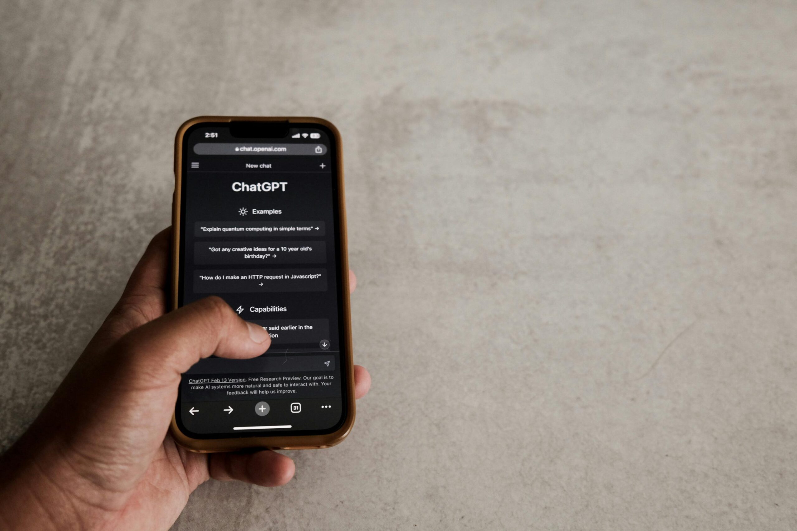 A close-up of a smartphone screen showing a conversation with ChatGPT, highlighting text input and generated response, set against a neutral background.